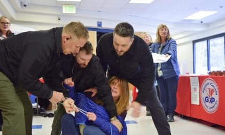 Idaho town hall meeting turns chaotic after woman is forcibly removed for heckling speakers