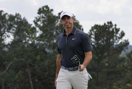 Golf-McIlroy rebounds at Masters to keep Grand Slam hopes alive