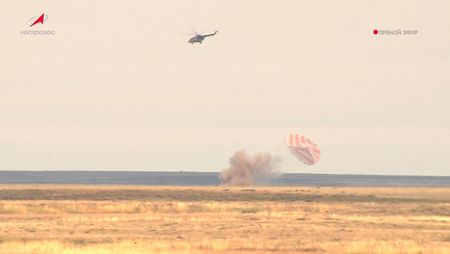 Spacecraft brings Russians, American back to earth, Russia’s space agency says