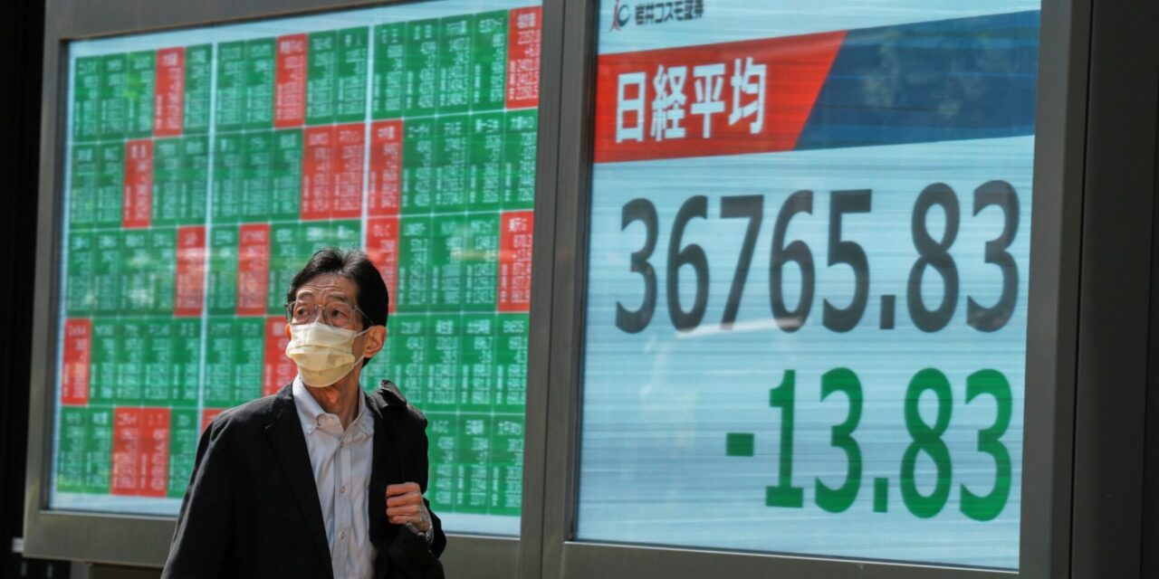 Asian shares trade higher after Wall Street climbs moderately as Fed holds rates steady